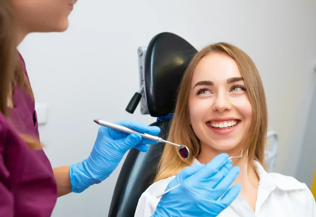 happy-woman-in-dentist-chair-ready-for-check-up-in-2026-03-23-23-04-00-utc-scaled.webp