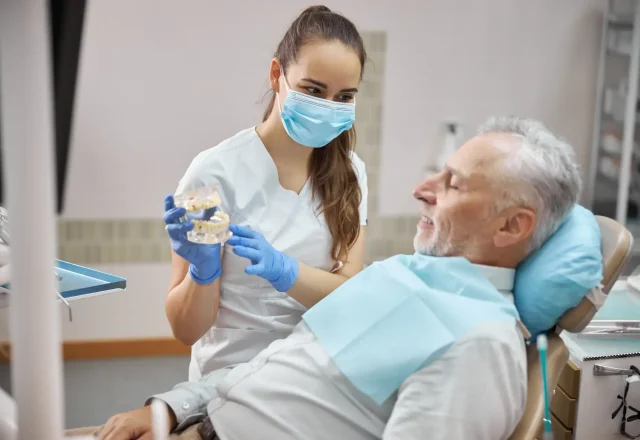 qualified-female-dental-specialist-holding-dental-2026-03-20-00-33-39-utc 1